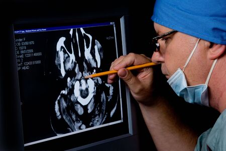 A medical doctor examining a CTT Scan.