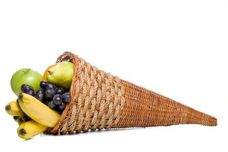 A cornucopia basket filled with delicious fresh fruit.の写真素材