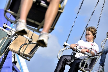 A young boy on a swing rideの写真素材