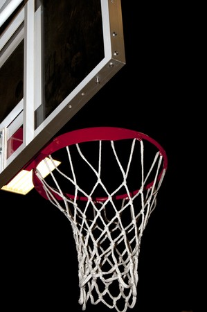 A basketball goal wating for a game to start.の写真素材