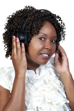 A black woman with headphones listening to music or learning a language