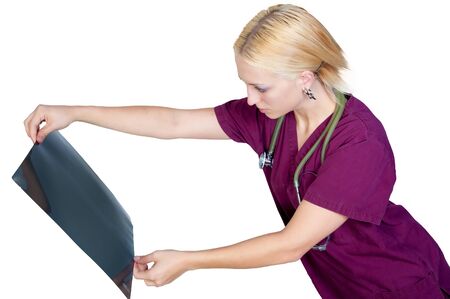 A beautiful female radiologist examining an x-ray