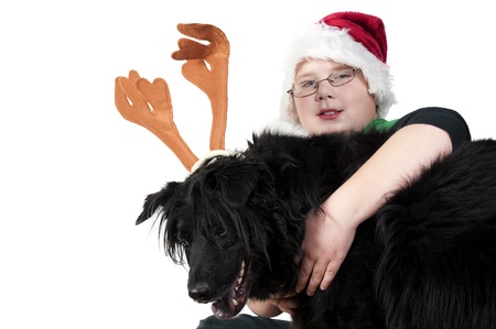 A Christmas boy and his reindeer black labradorの写真素材