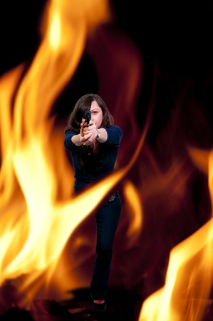 A beautiful police detective woman on the job with a gunの写真素材