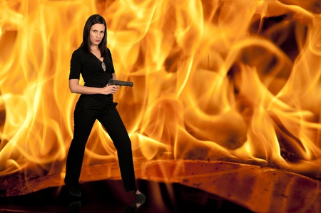 A beautiful police detective woman on the job with a gunの写真素材