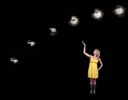 A beautiful woman displaying a series of full moons across the night sky