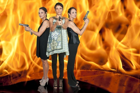 Beautiful police detective women on the job with gunsの写真素材