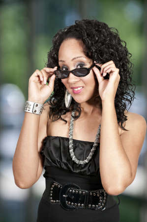 A black woman sporting a pair of sunglassesの写真素材