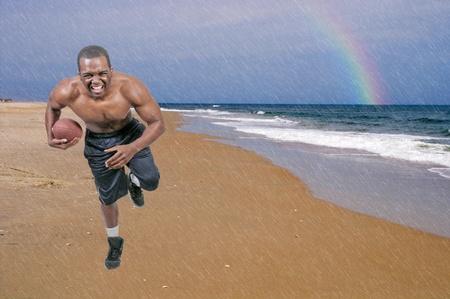 Black African American man playing a game of footballの写真素材