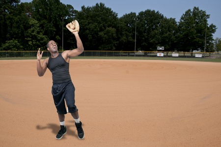 A black African American man baseball player at a game