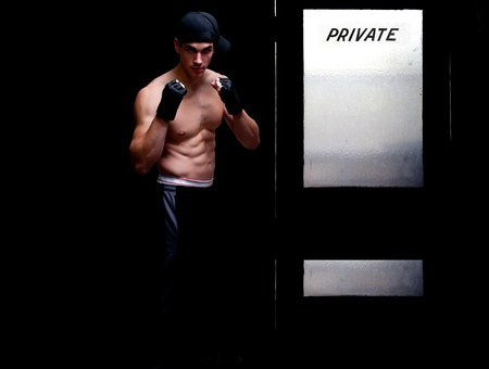 Attractive man athletic boxer in a fighting stanceの写真素材