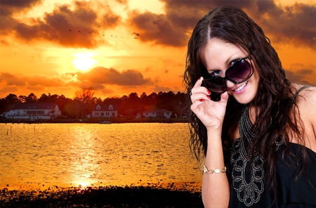 A beautiful woman wearing a pair of sunglassesの写真素材