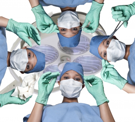 Beautiful young women surgeons performing surgeryの写真素材