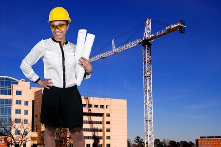 Beautiful black African American woman construction foreman with hard hat and safety glassesの写真素材