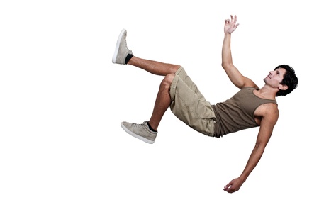 Handsome young man tripping slipping and fallingの写真素材