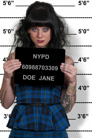 Mugshot of a beautiful young woman criminalの写真素材
