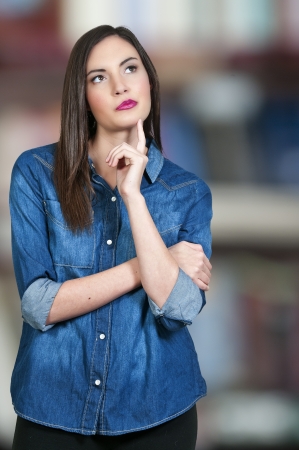 Beautiful woman thinking and deep in thoughtの写真素材