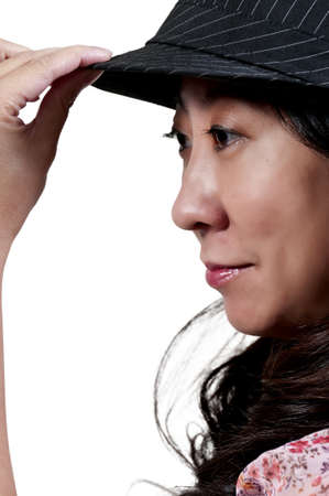 Beautiful asian woman in a fedora hatの写真素材