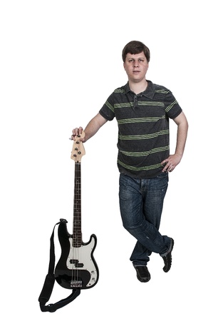 Young man holding a bass guitar musical instrumentの写真素材