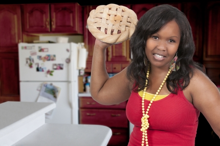 Beautiful woman having a friendly pie fightの写真素材