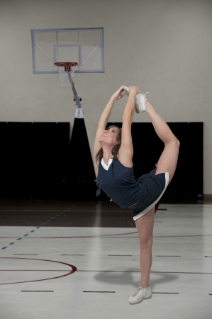 Beautiful young woman in a cheerleading uniformの写真素材