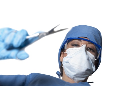 Beautiful young woman surgeon performing a surgery