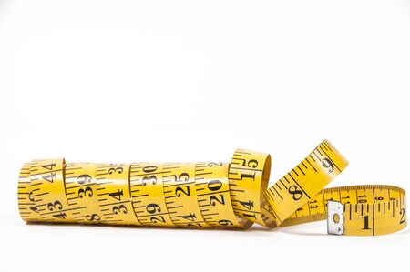Tailors measuring tape coiled up randomly