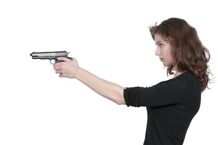 Beautiful woman with a loaded handgun pistolの写真素材