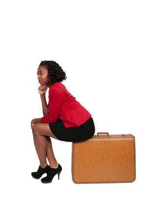 Beautiful young woman going on vacation with a suitcaseの写真素材