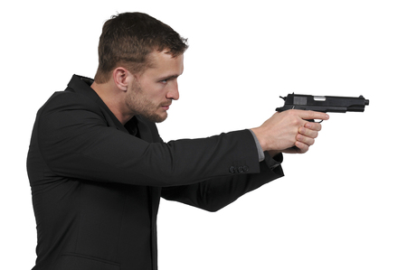 Police detective man on the job with a gunの写真素材