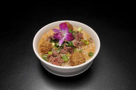 Delicious cuisine known as beef and noodle soupの写真素材