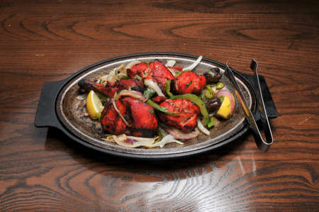 Traditional and authentic indian cuisine known as tandoori chickenの写真素材