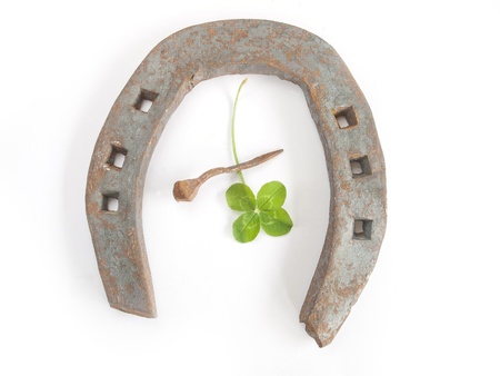 horseshoe with clover on white background の写真素材
