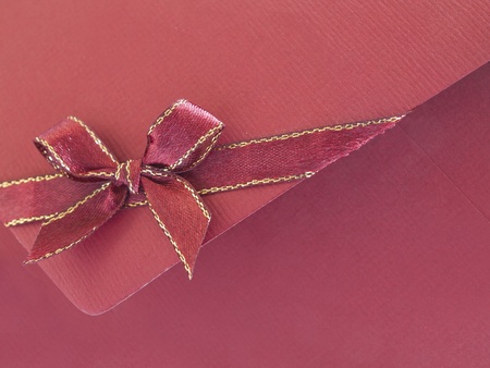Red paper envelope with bow