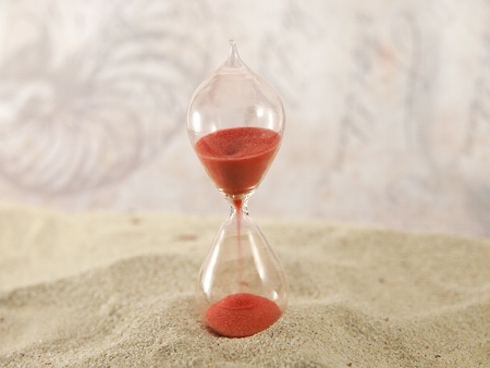 hourglass sand and abstract backgroundの写真素材