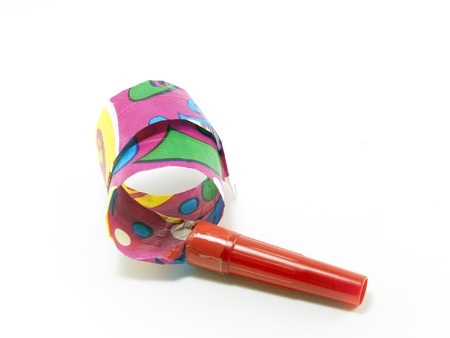 some party horns of different colors on a white background の写真素材