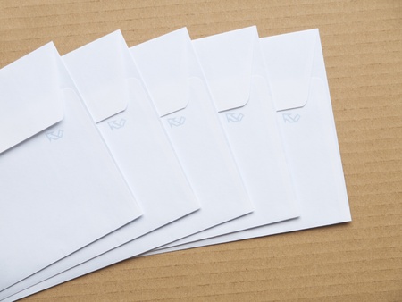 white envelope on cardboard backgroundの写真素材