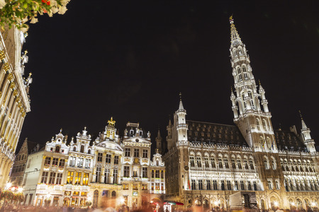 Wide angle night scene of the Grand Place, the focal point of Brussels, Belgium. The Town Hall (Hotel de Ville) is dominating the composition with its 96m tall spireのeditorial素材