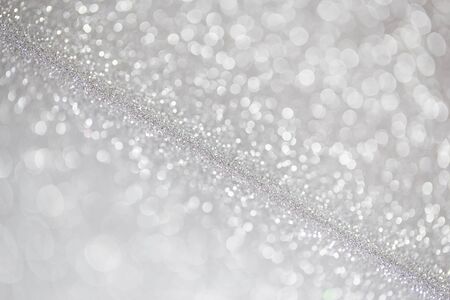Unfocused abstract silver glitter holiday backgroundの写真素材