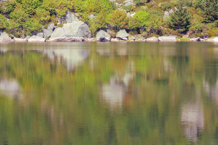 lake shore with reflection in the water. copy spaceの写真素材
