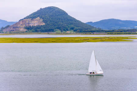 Sailing in a sailboat in the bay of SantoÃ±aの写真素材
