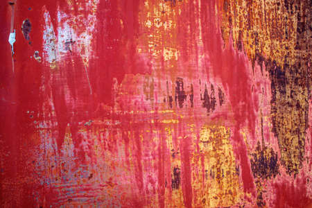 rusty metal texture with old chipped red paint. backgroundの写真素材
