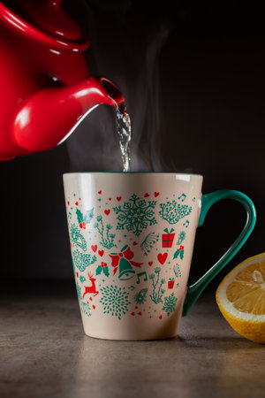 Teapot and a cup of tea. Steam coming out of the cup of teaの写真素材
