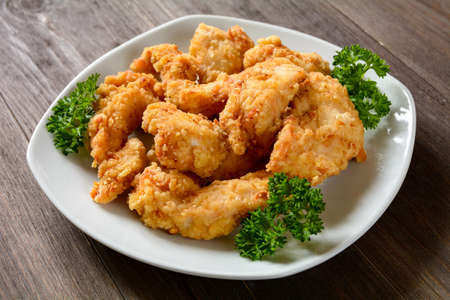 baked chicken pieces in breadcrumbsの写真素材