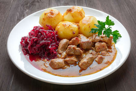 shoulder meat in sauce with potatoes and beetrootsの写真素材