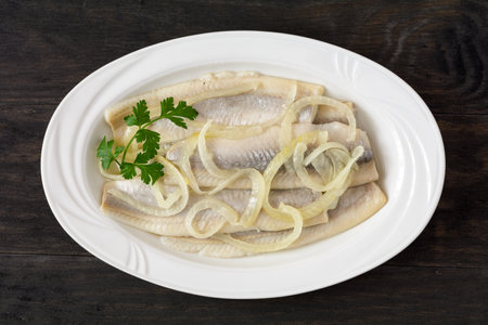 herring marinated in oil with onionの写真素材
