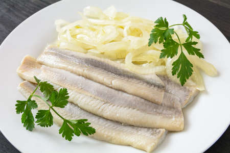 herring marinated in oil with onionの写真素材