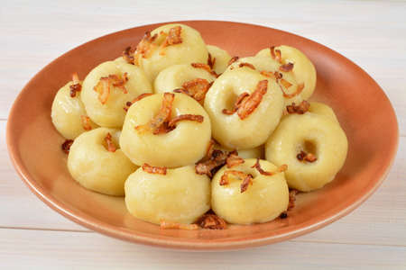 Silesian dumplings with fried onionの写真素材