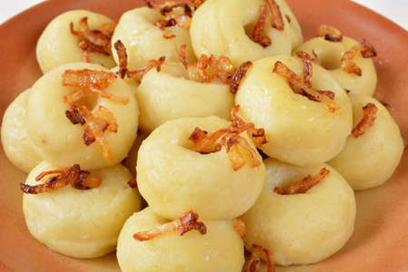 Silesian dumplings with fried onionの写真素材