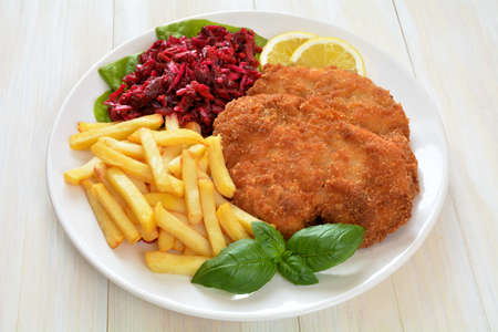 cutlet with fries and salad